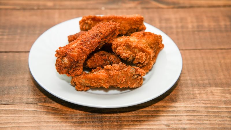 Garlic Parmesan Wings with rich cheese coating from Wings over
